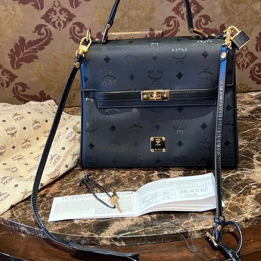 MCM black bag front flap with lock and keys